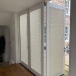 Pleated blind door